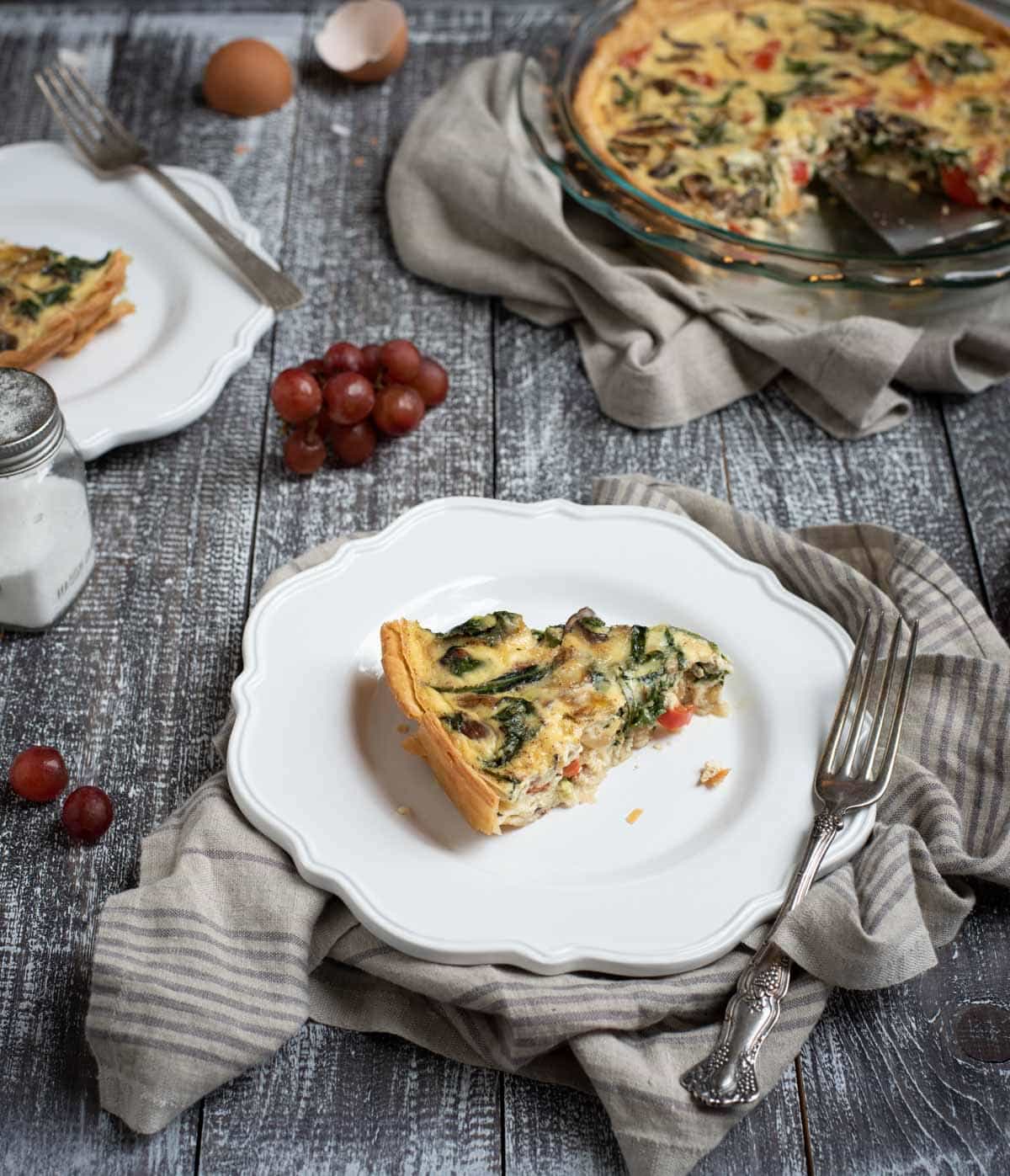 Plate with vegetable quiche slice
