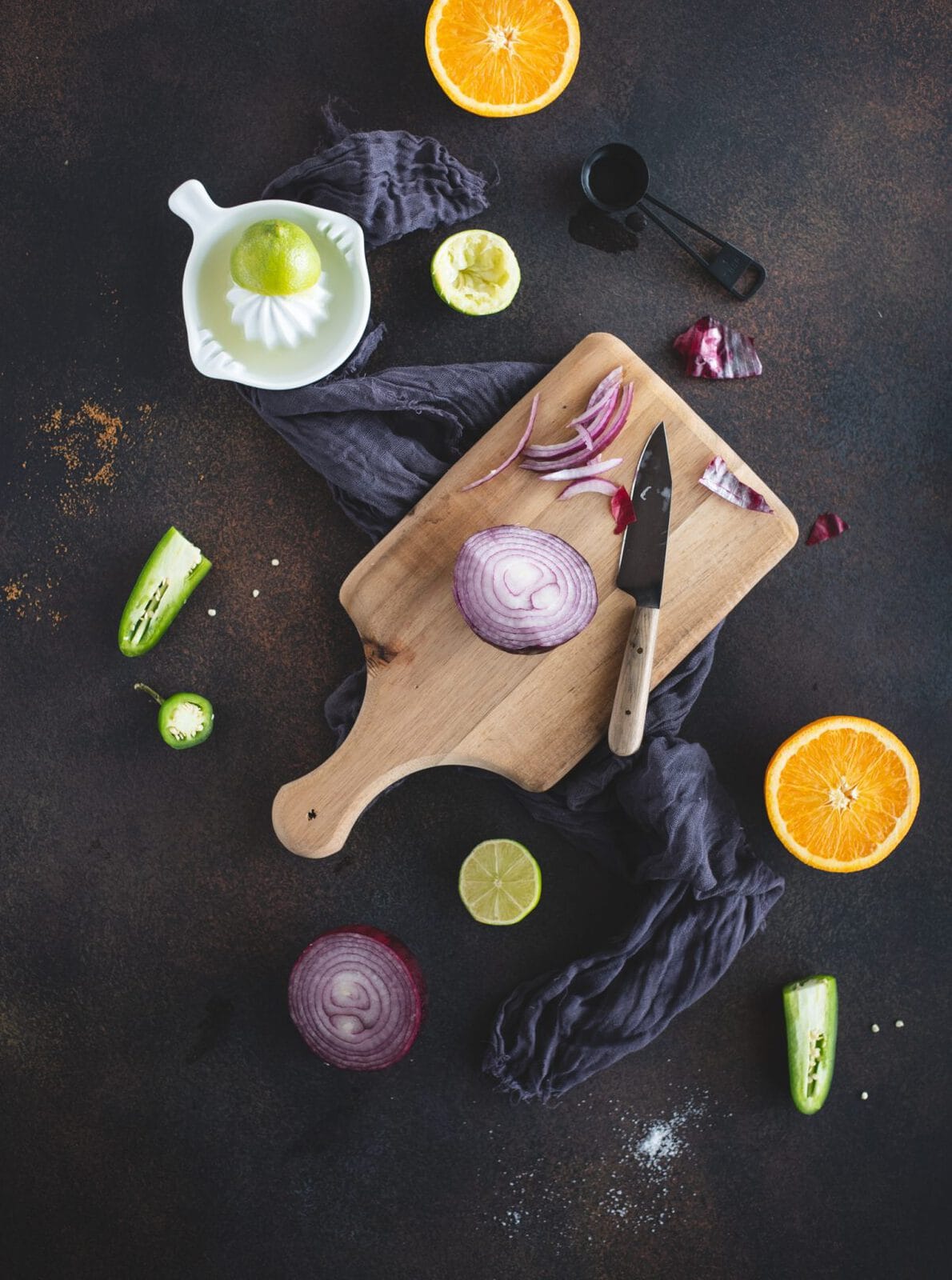 Overhead picture of pickled red onion ingredients on dark background