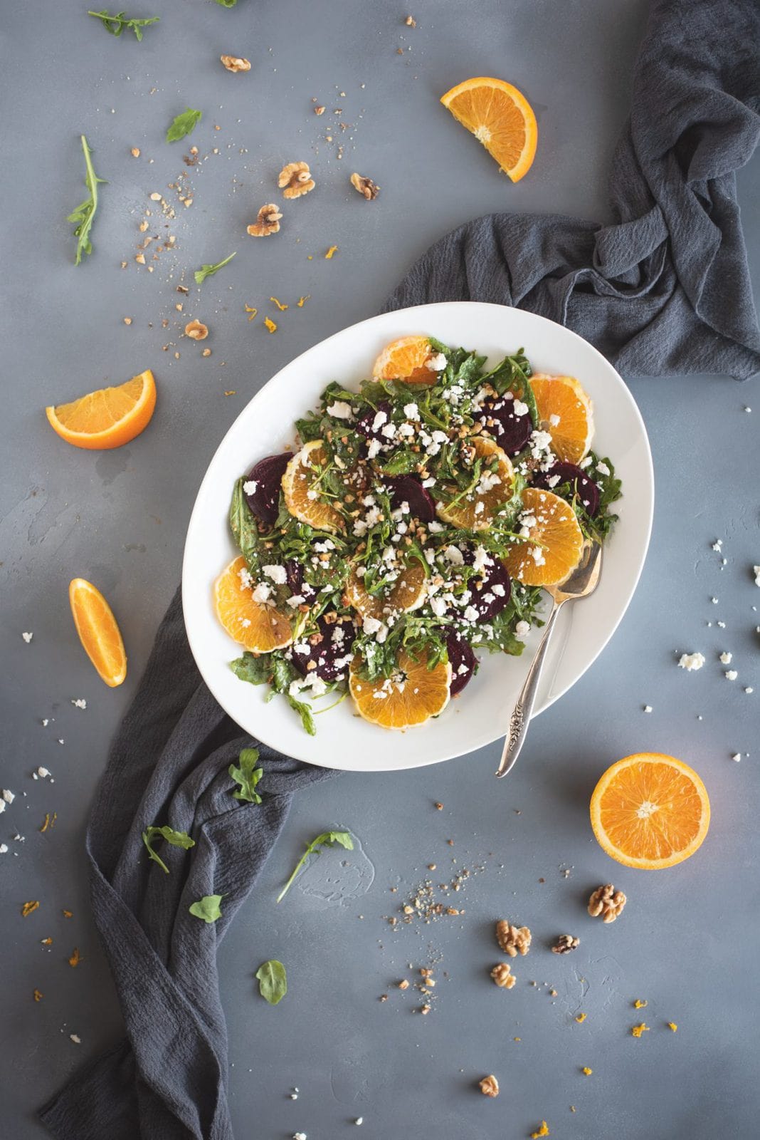 Photo of arugula salad with roasted beets and orange slices