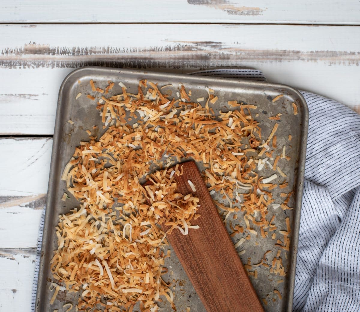 toasted coconut on a pan for banana ice cream