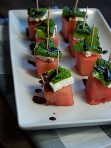 These watermelon feta mint skewers are refreshing as is, but the tangy balsamic glaze makes this healthy appetizer absolutely delicious!