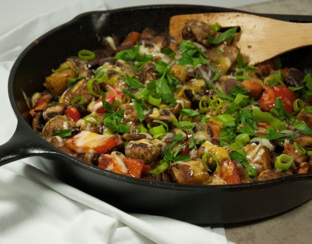This satisfying ooey gooey cheesey potato skillet is the ultimate comfort food made lighter with sweet potato, red pepper, mushrooms, and fresh herbs. 