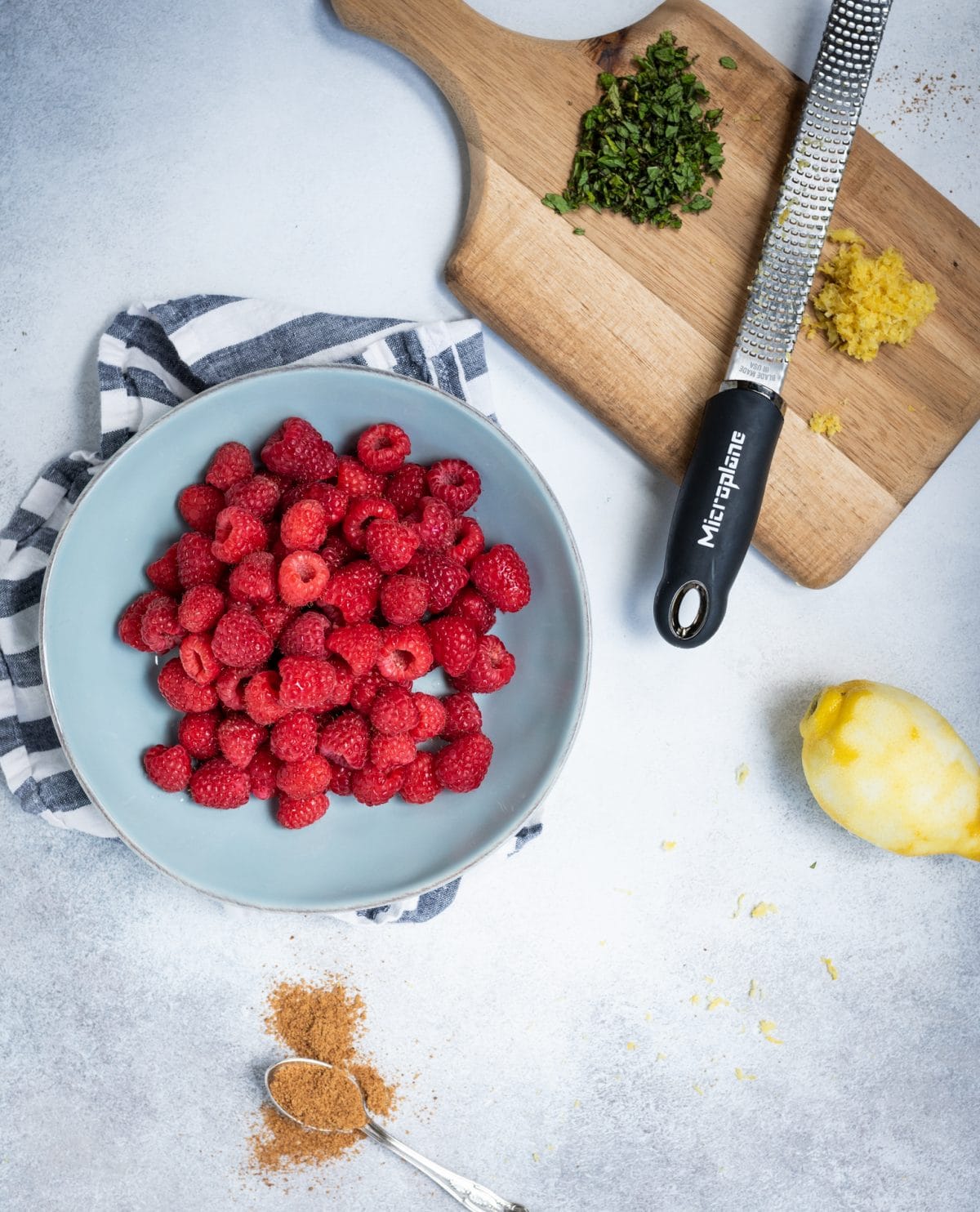 Overhead picture of Raspberries with lemon zest and mint ingredients