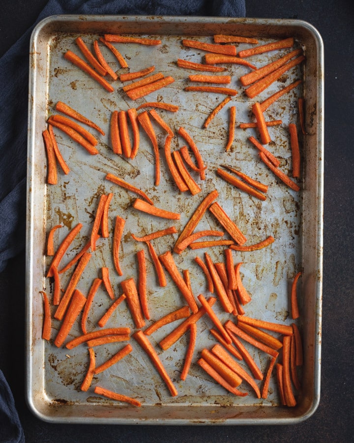 pan with sliced cooked carrots spread out