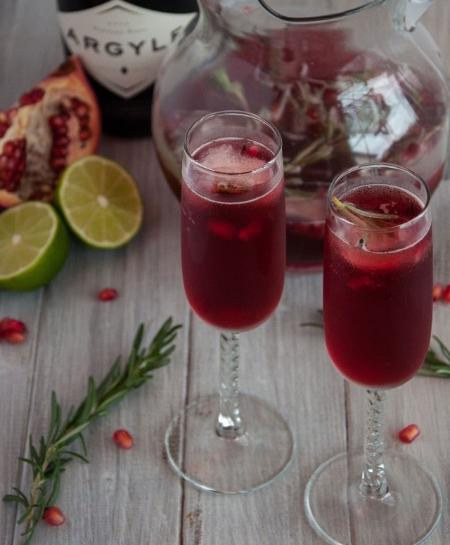 Rosemary pomegranate mimosas encapture the essence of relaxed holiday gatherings where festive simplicity leaves more time to enjoy with family and friends.