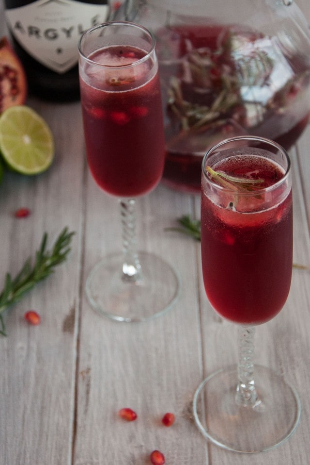 Rosemary pomegranate mimosas encapture the essence of relaxed holiday gatherings where festive simplicity leaves more time to enjoy with family and friends.