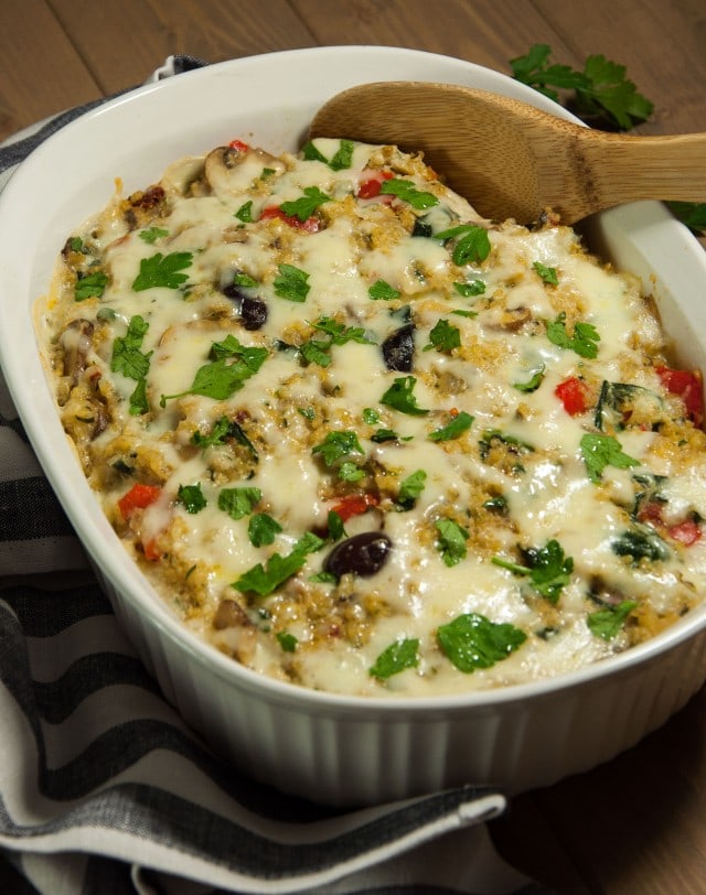 Cheesy quinoa casserole with creamy white sauce is rich, comforting, and loaded with nutritious veggies with just 350 calories in each generous portion.