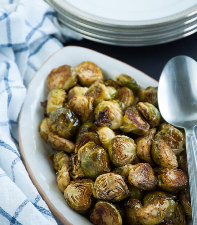 Roasted brussel sprouts are caramelized to perfection and then tossed in a tangy, savory browned butter sauce for ultimate yum factor.