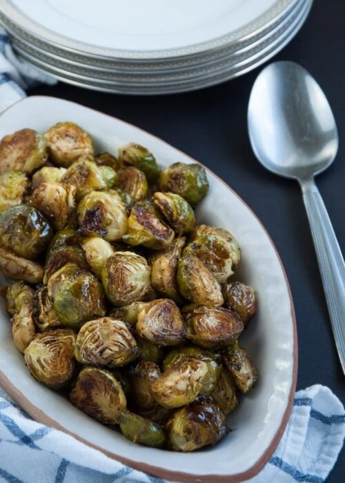 Roasted brussel sprouts are caramelized to perfection and then tossed in a tangy, savory browned butter sauce for ultimate yum factor.