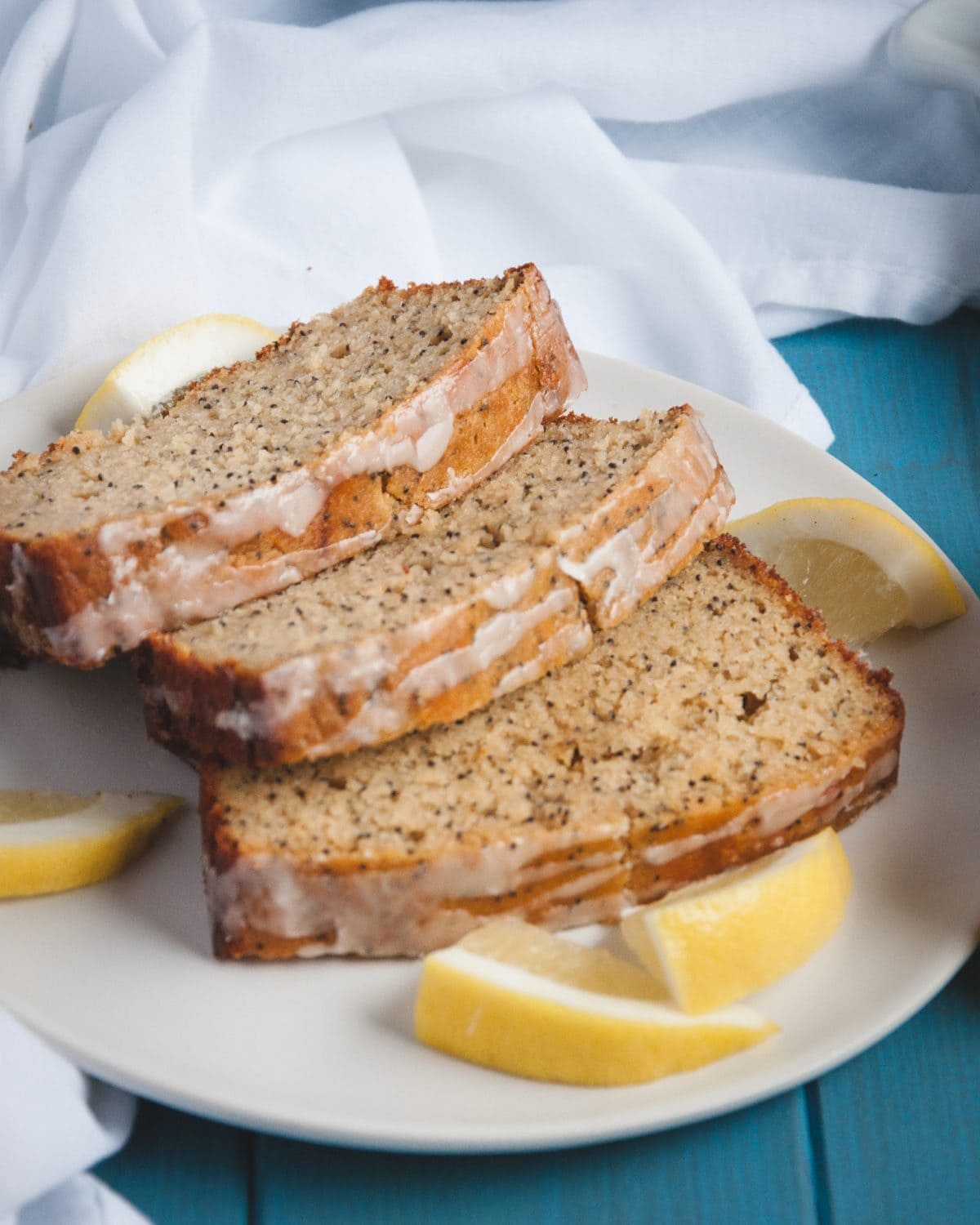 slices of Whole Wheat Lemon Poppy Seed Bread on a white plate