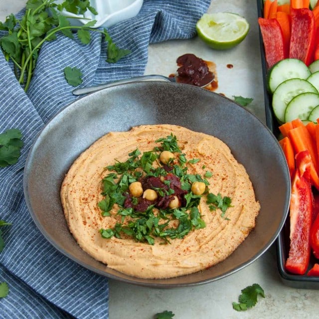 Chipotle hummus is a little bit spicy, ultra creamy and 100% delicious! Its packed with lean protein and fiber making it the perfect healthy snack.