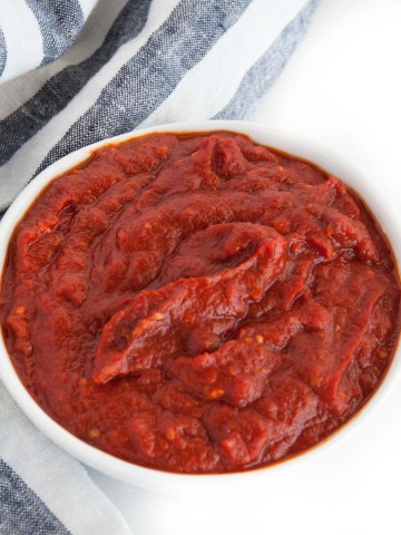 Spicy, smooth, delicious red enchilada sauce that goes equally well with classic chicken or roasted vegetable enchiladas.