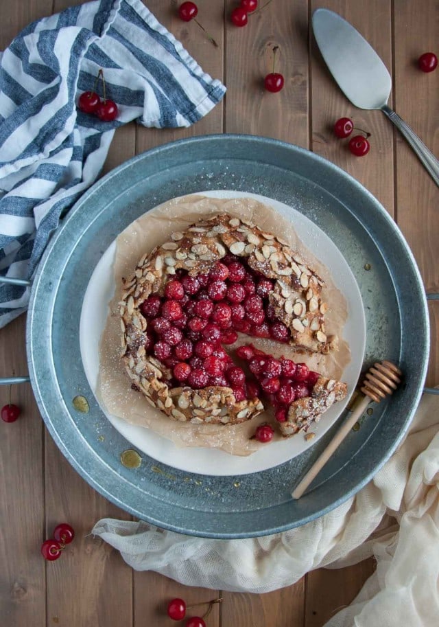 In this tasty sour cherry galette, tart cherries and heart healthy almonds come together in a nutritious whole wheat and almond flour crust for a perfect healthy desert.