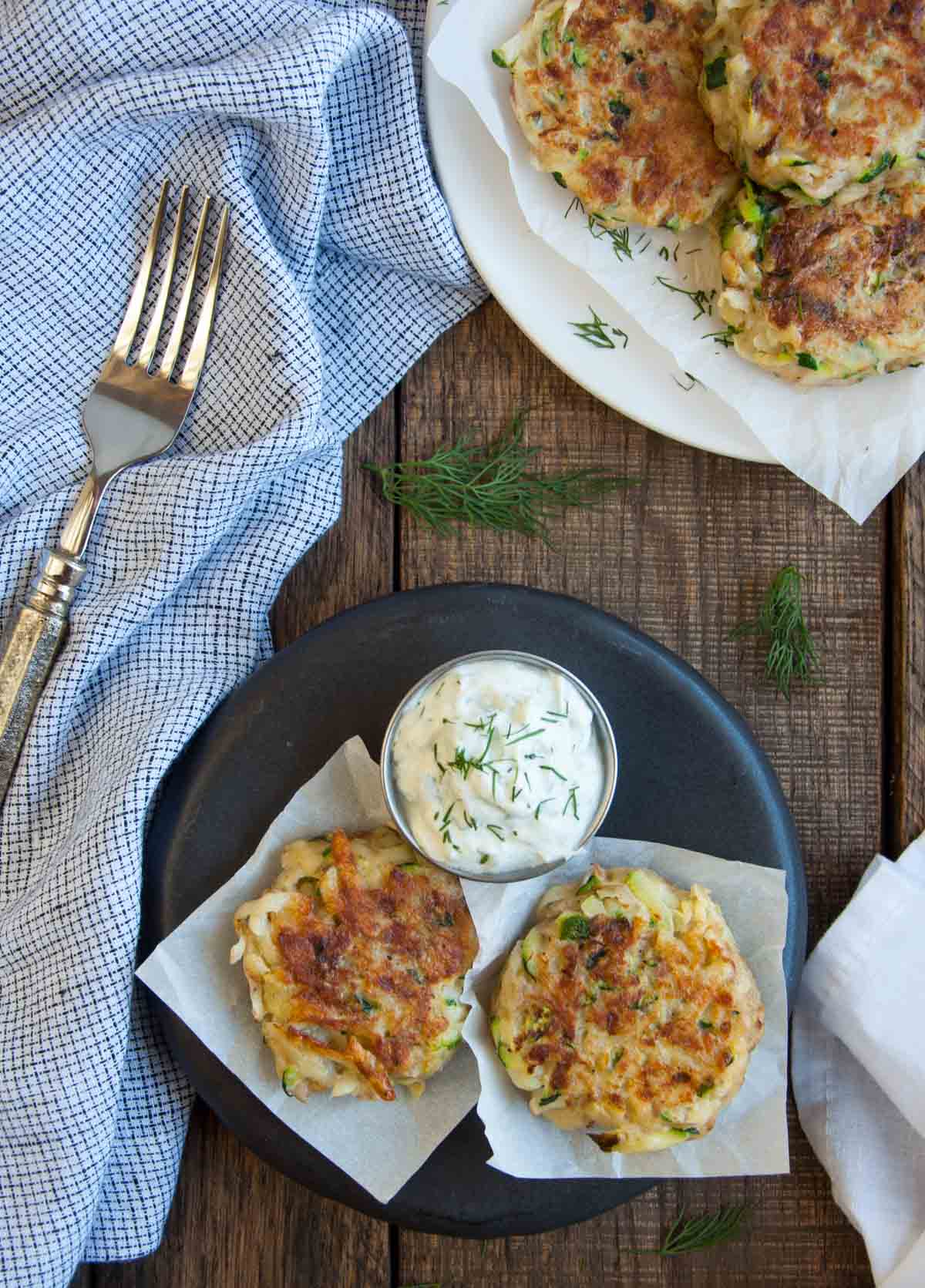 Crispy on the outside and soft on the inside, these zucchini cakes are a tasty way to use that garden produce. The tangy yogurt dill dipping sauce makes these a perfect appetizer.
