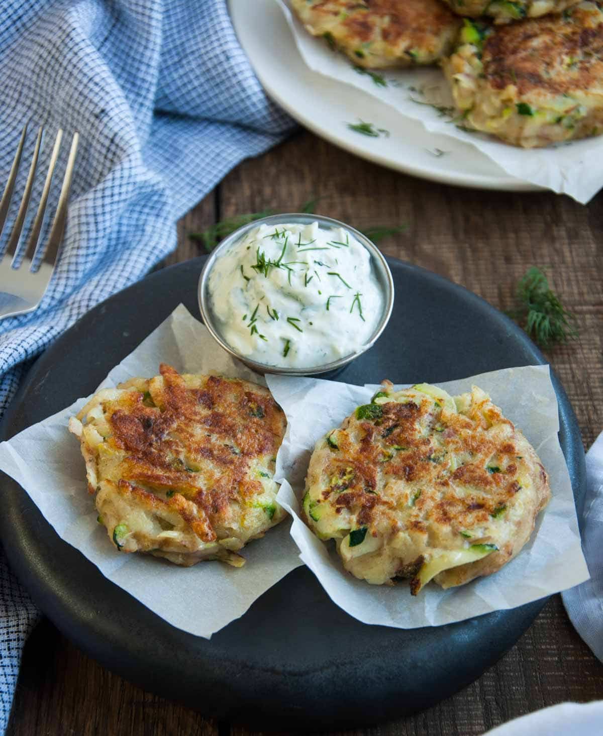 Crispy on the outside and soft on the inside, these zucchini cakes are a tasty way to use that garden produce. The tangy yogurt dill dipping sauce makes these a perfect appetizer.