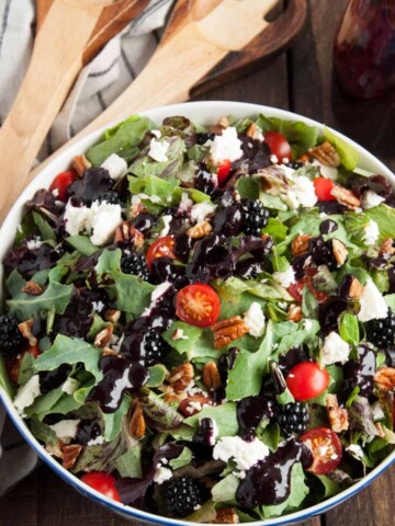 This deliciously fresh summer salad with feta, pecans, basil and blackberry vinaigrette is a perfect light and healthy salad for a quick weeknight meal.