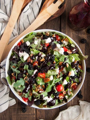 This deliciously fresh summer salad with feta, pecans, basil and blackberry vinaigrette is a perfect light and healthy salad for a quick weeknight meal.