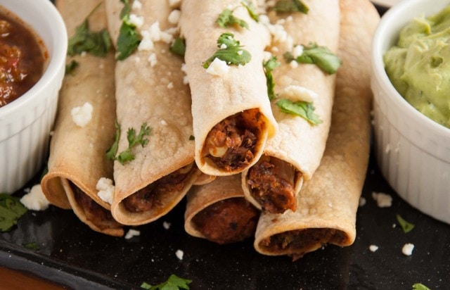 These baked black bean taquitos are both vegetarian, packed with veggies, and way lighter than the store bought kind without sacrificing any flavor.