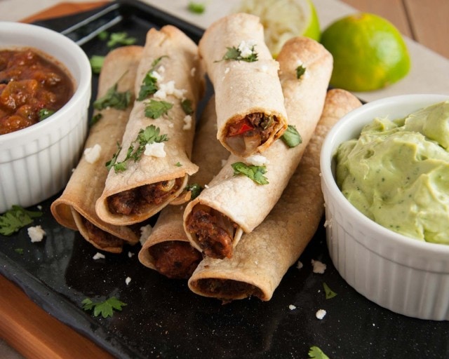 These baked black bean taquitos are both vegetarian, packed with veggies, and way lighter than the store bought kind without sacrificing any flavor.