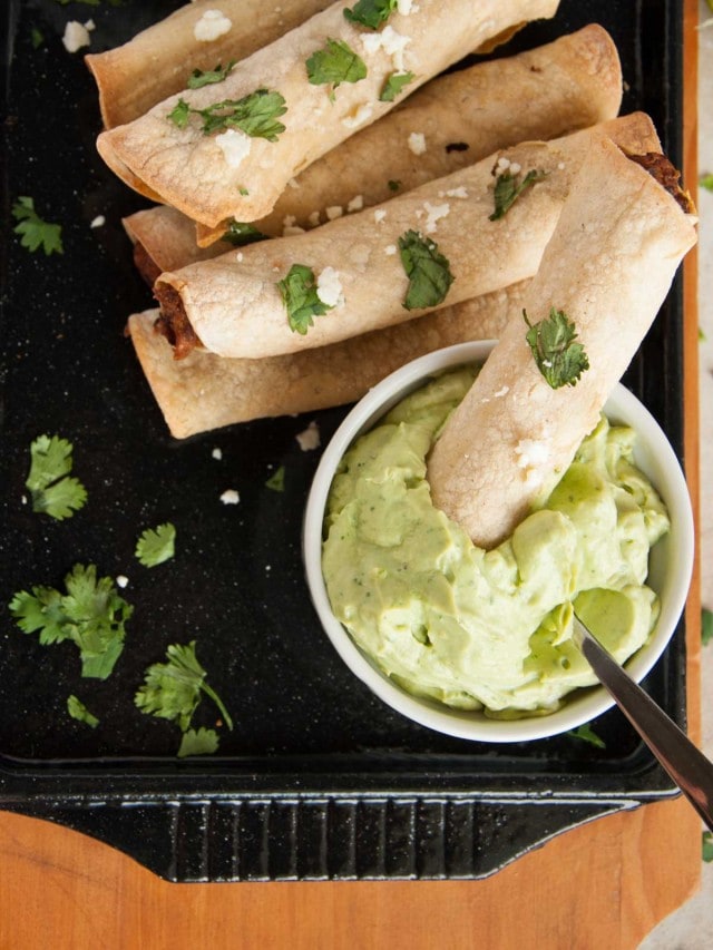 These baked black bean taquitos are both vegetarian, packed with veggies, and way lighter than the store bought kind without sacrificing any flavor.