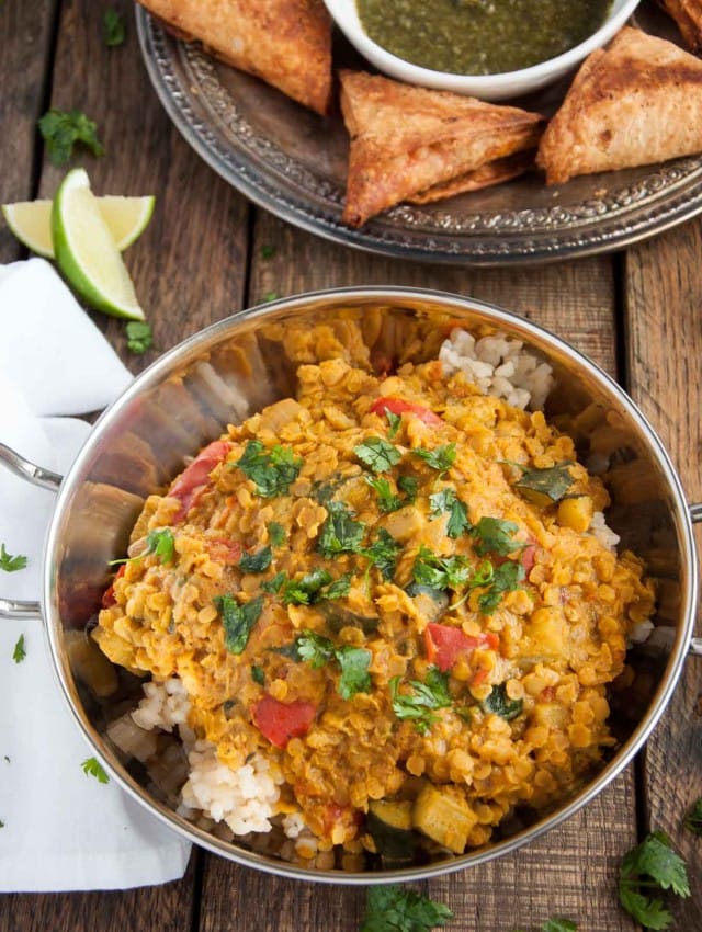 Filled with aromatic spices, lentils never tasted so good! This healthy red lentil dal is inexpensive, nutritious, high in protein, and brimming with flavor.