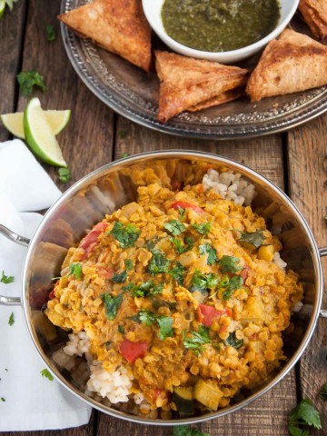 Filled with aromatic spices, lentils never tasted so good! This healthy red lentil dal is inexpensive, nutritious, high in protein, and brimming with flavor.