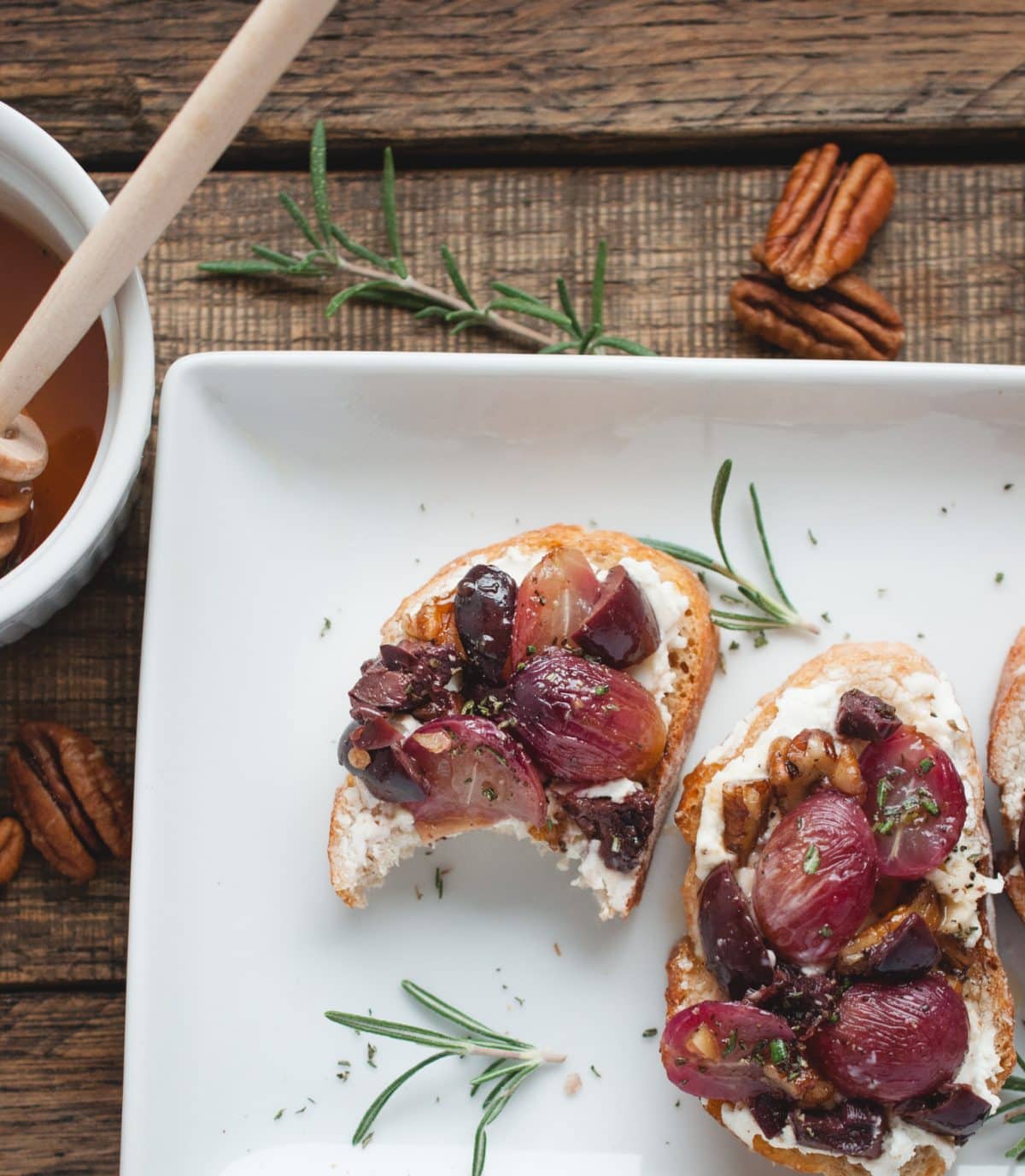 overhead picture of crostini with a bite taken out of it 