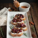 With roasted grapes, goat cheese, rosemary, and pecans piled high on crostini, this appetizer is bursting with flavor and is a crowd pleaser at any event! - Feasting Not Fasting