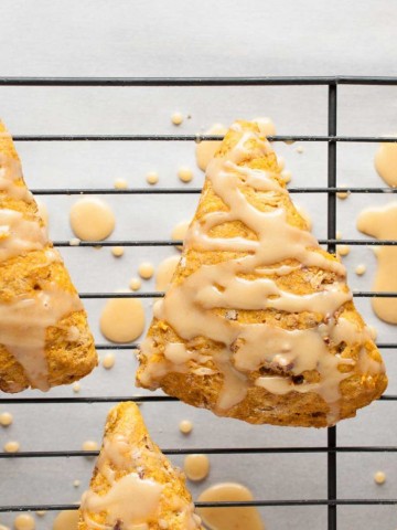 These easy pumpkin scones are both healthy and delicious! They're loaded with pumpkin, toasted pecans, and use whole wheat flour and less sugar. - Feasting Not Fasting
