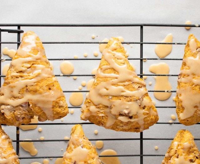 These easy pumpkin scones are both healthy and delicious! They're loaded with pumpkin, toasted pecans, and use whole wheat flour and less sugar. - Feasting Not Fasting