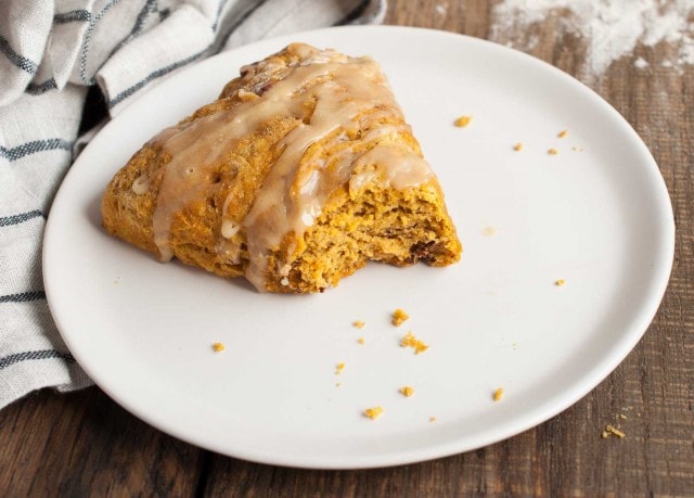 These easy pumpkin scones are both healthy and delicious! They're loaded with pumpkin, toasted pecans, and use whole wheat flour and less sugar. - Feasting Not Fasting