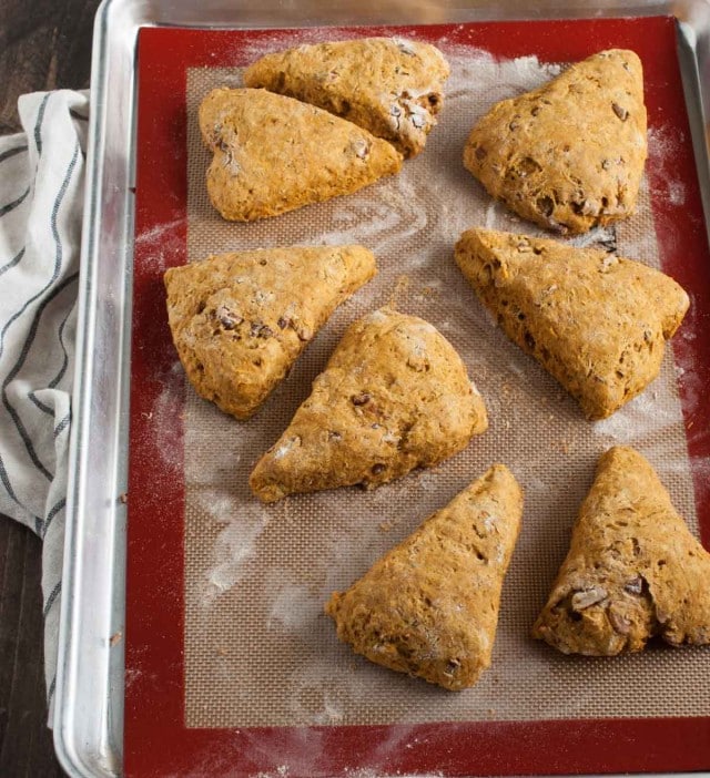 These easy pumpkin scones are both healthy and delicious! They're loaded with pumpkin, toasted pecans, and use whole wheat flour and less sugar. - Feasting Not Fasting