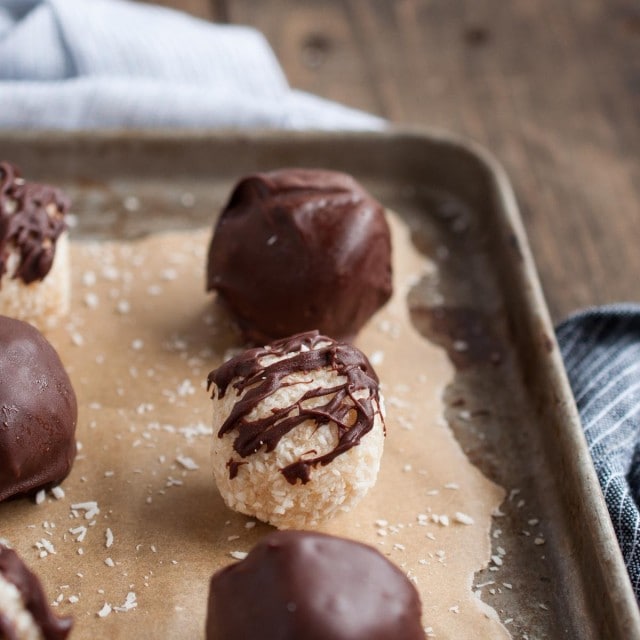 These chocolate coconut balls are made healthier with unsweetened coconut, maple syrup, and coconut oil. They're so delicious you'd never know it though!