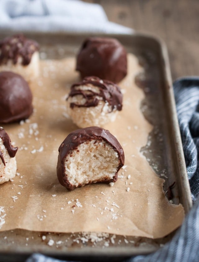 These chocolate coconut balls are made healthier with unsweetened coconut, maple syrup, and coconut oil. They're so delicious you'd never know it though!