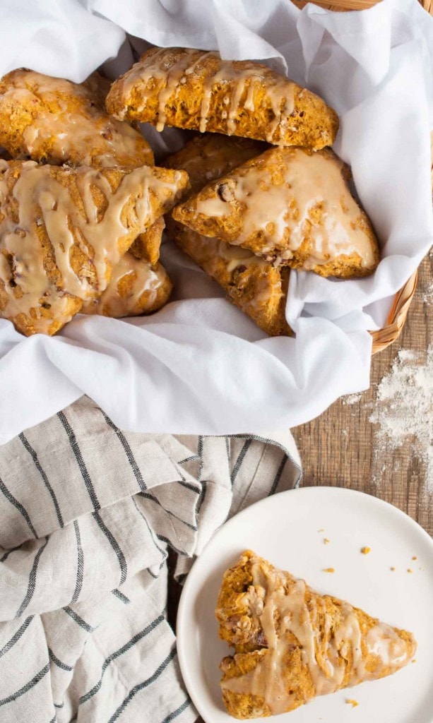 These easy pumpkin scones are both healthy and delicious! They're loaded with pumpkin, toasted pecans, and use whole wheat flour and less sugar. - Feasting Not Fasting