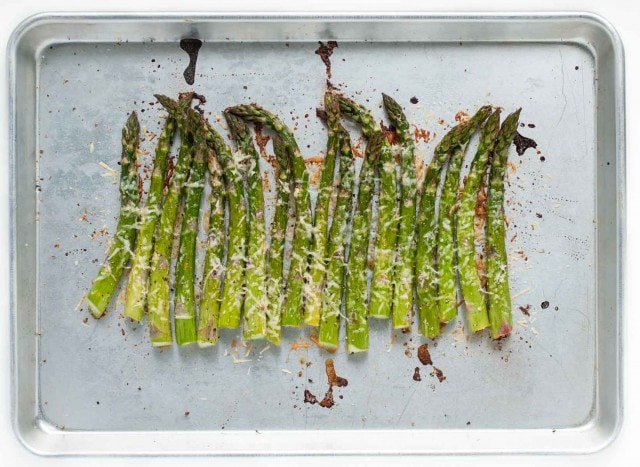 It will take longer for the oven to heat up than to prep this tasty lemon parmesan asparagus! Simple ingredients come together in this classic versatile side dish. - Feasting Not Fasting