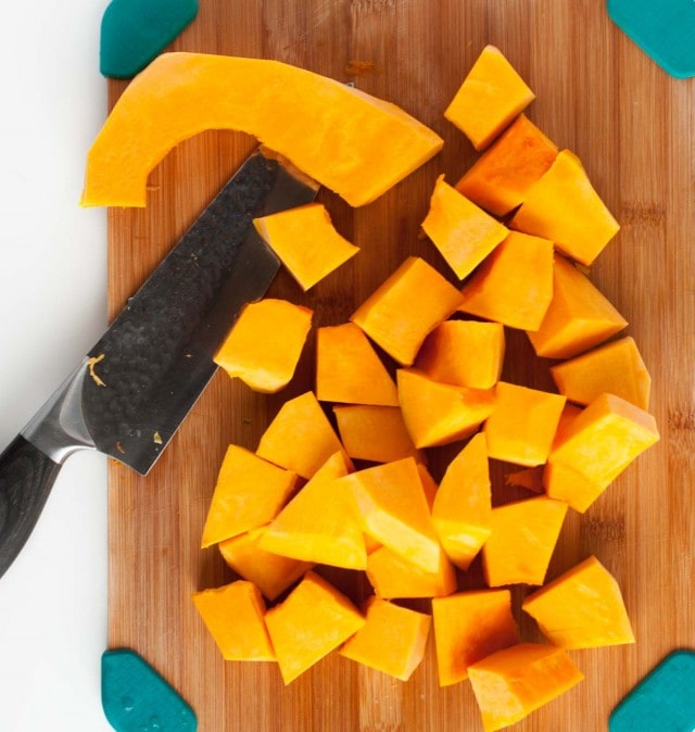 This thick, creamy sweet meat squash soup is naturally vegan, yet extremely filling and delicious! The rich curry flavor is accented with fresh cilantro, chili sauce, and roasted peanuts.