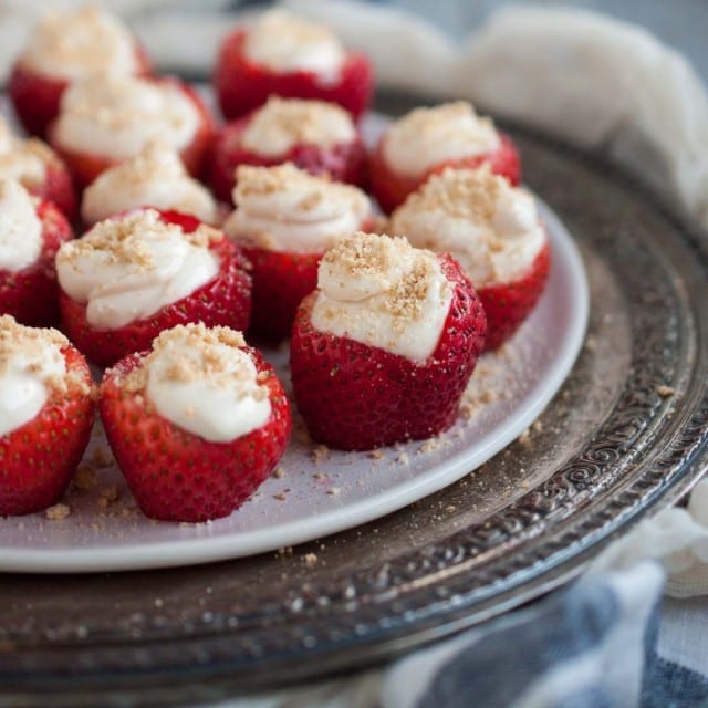 These tasty cheesecake stuffed strawberries are a healthier dessert that will actually satisfy your sweet tooth for under 100 calories per serving.