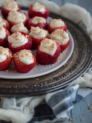 These tasty cheesecake stuffed strawberries are a healthier dessert that will actually satisfy your sweet tooth for under 100 calories per serving.