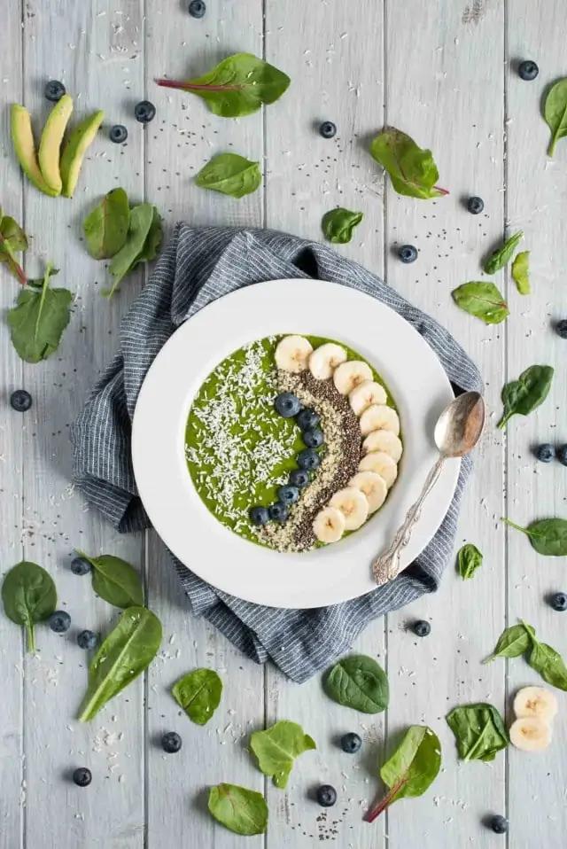 Creamy, delicious green smoothie bowl to power your morning and kick start your day with 9 grams of protein, 11 grams of fiber, and an abundance of vitamins and nutrients.