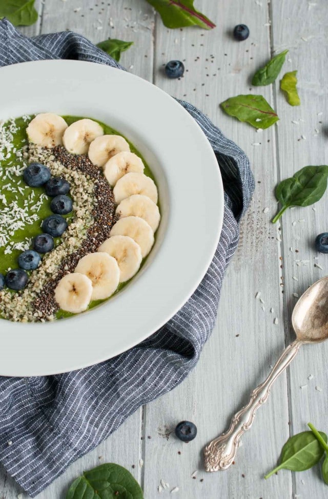 Creamy, delicious green smoothie bowl to power your morning and kick start your day with 9 grams of protein, 11 grams of fiber, and an abundance of vitamins and nutrients.