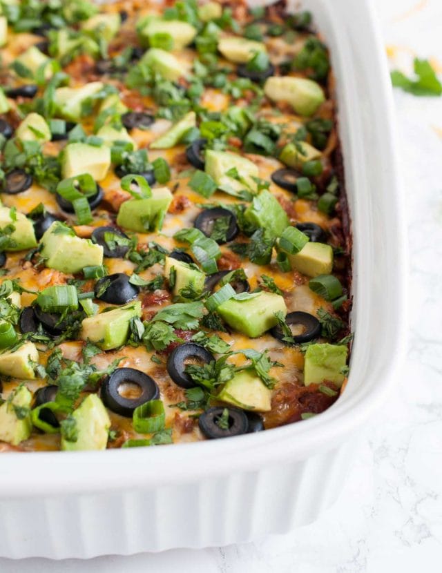 This easy chicken enchilada casserole is full of flavor and an ultimate crowd pleaser. It has the same great enchilada taste but with way less work!