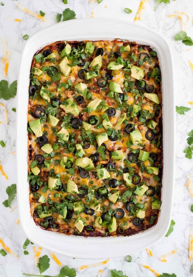 This easy chicken enchilada casserole is full of flavor and an ultimate crowd pleaser. It has the same great enchilada taste but with way less work!
