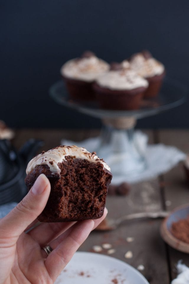 Chocolate peanut butter cupcakes that are outrageously decadent and rich but made healthy with oat flour, honey, and banana and coconut cream based frosting.