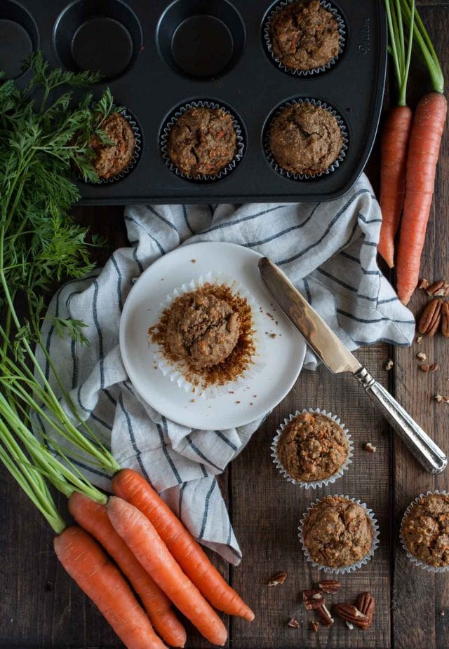 These healthy carrot muffins are made with oat flour, applesauce, honey, coconut oil and a tasty mix of spices that will remind you of carrot cake!