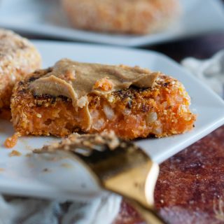 These brown rice sweet potato patties are enhanced by a savory tahini dipping sauce that makes them a tasty and healthy appetizer, light meal, or snack.