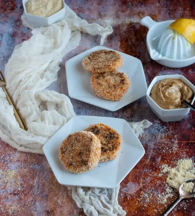 These brown rice sweet potato patties are enhanced by a savory tahini dipping sauce that makes them a tasty and healthy appetizer, light meal, or snack.