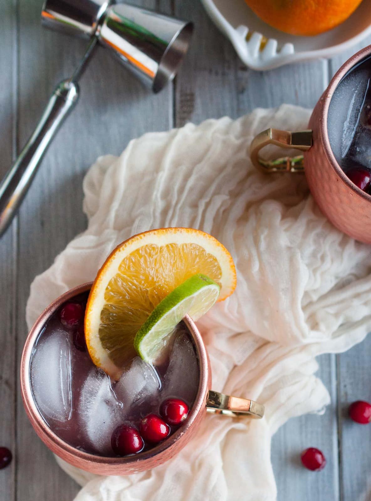 Cranberry Moscow mule recipe made with zesty orange, zippy ginger beer, vodka, lime, and cranberry just might be the most refreshing drink on the planet. Try one today!