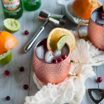 Cranberry Moscow mules made with zesty orange, zippy ginger beer, vodka, lime, and cranberry just might be the most refreshing drink on the planet. Try one today with this recipe!