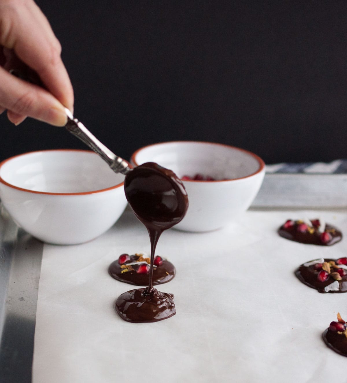 Dark chocolate pomegranate bites are a simple tasty treat to eat or give as Christmas gifts. Made to satisfy a sweet tooth for under 100 calories! 